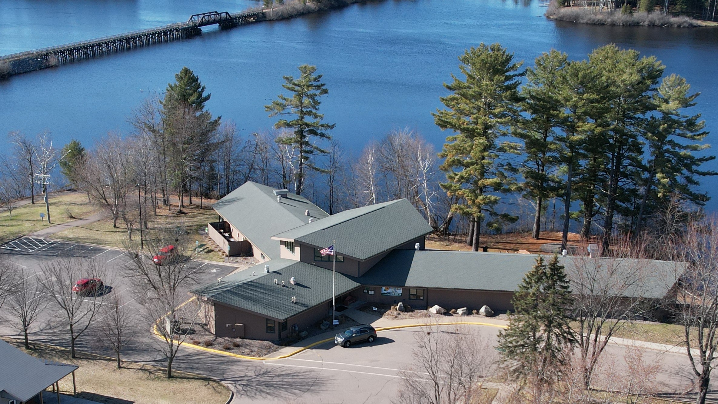 Aerial view of library next to a lake
