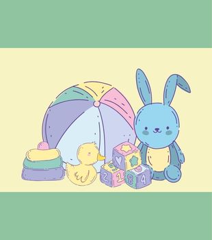 Children's toys including a pastel ball, duck, blocks, and stuffed bunny.